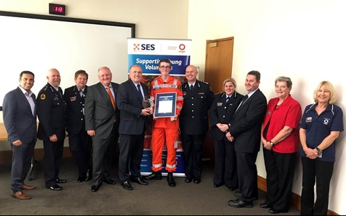 Sam Corby receiving his award with Minister for Emergency Services David Elliott and NSW SES Acting Commissioner Greg Newton.