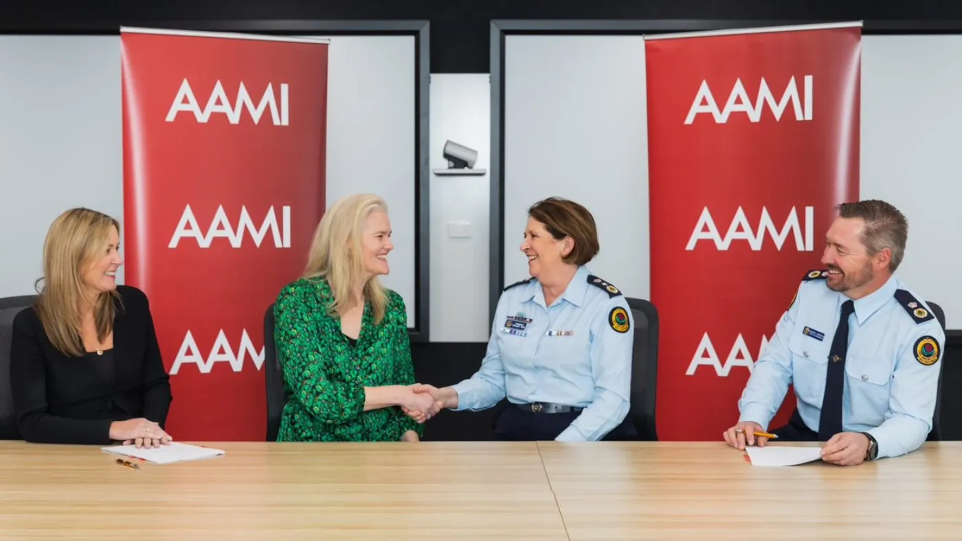 Representatives from AAMI shaking hands with Commissioner Carlene York and Deputy Commissioner Damien Johnston.