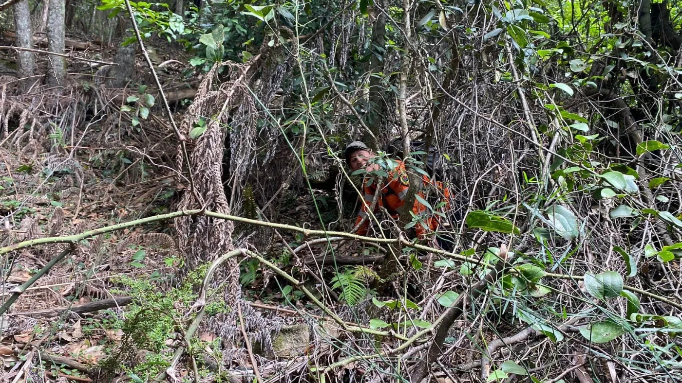 A Bush serach and rescure volunteer walking in the bush