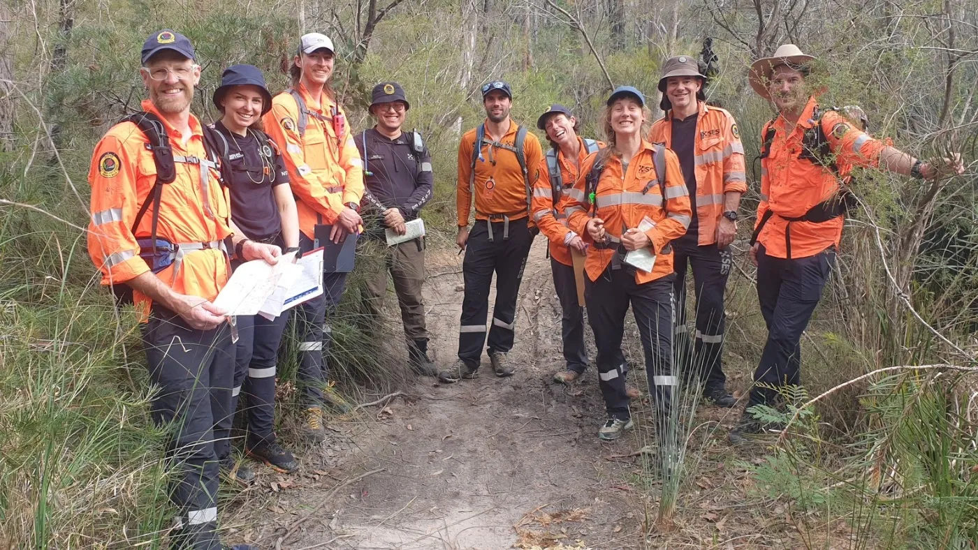 A group of Bush serach and rescure volunteers standing together and smiling for the camera