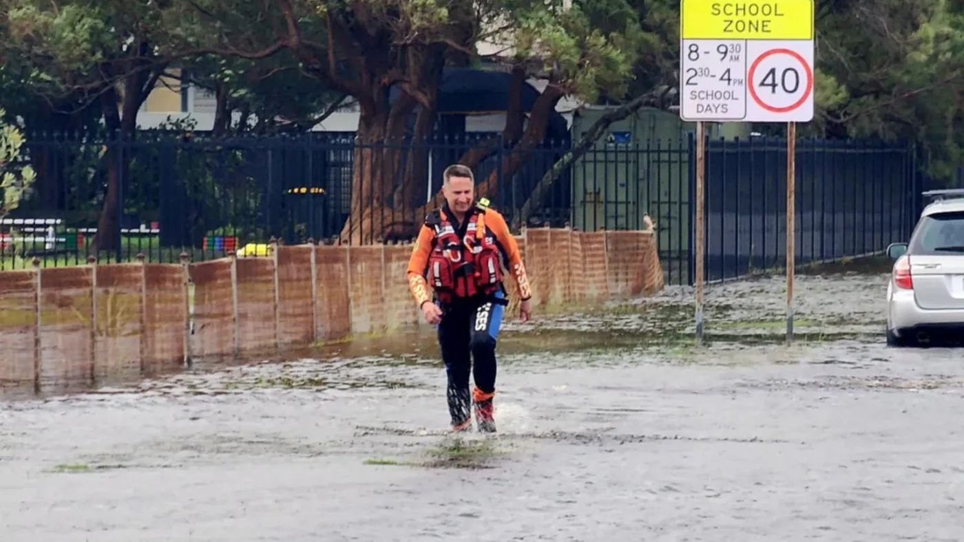 Flood rescue operator walking through flood water