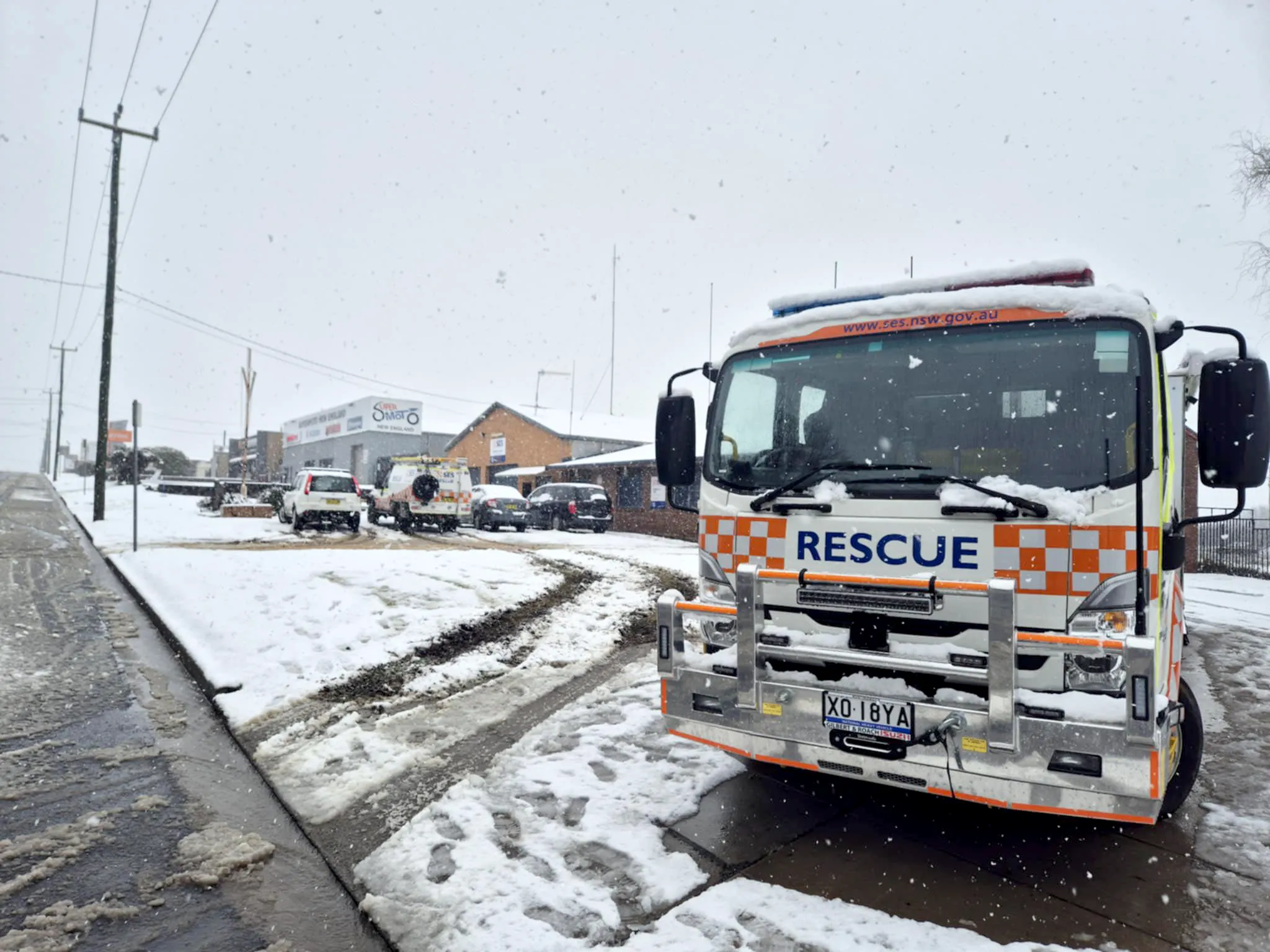 Rescue truck parked in Armidale covered in snow.