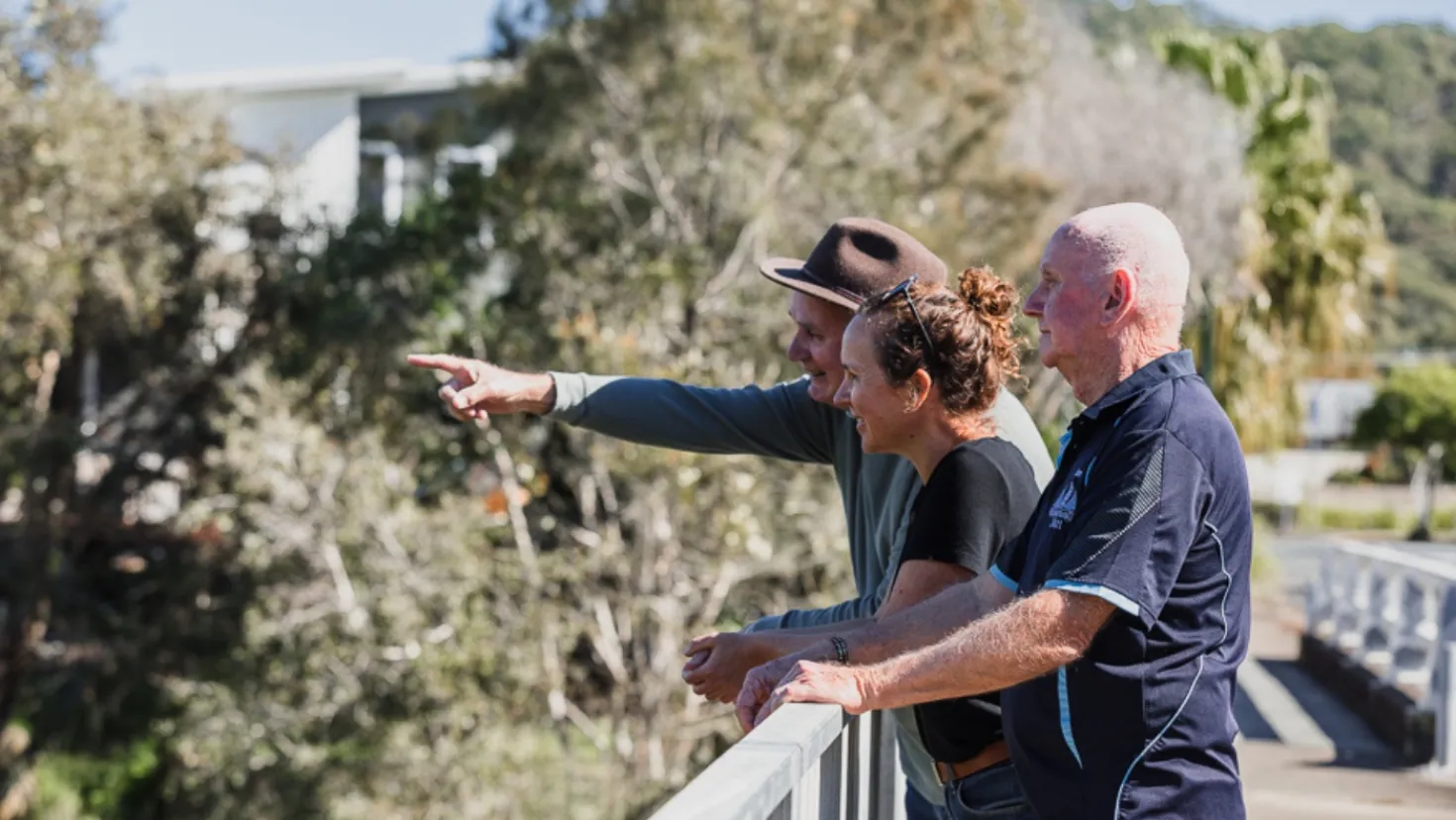 Community members look out to river
