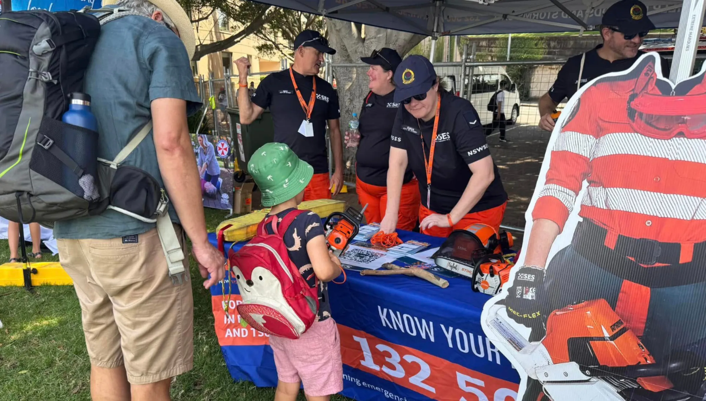 NSW SES event display with visitors standing in front. 