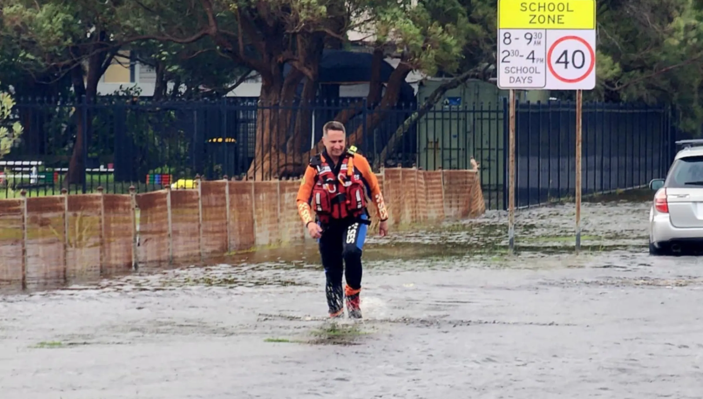 Flood rescue operator walking through flood water
