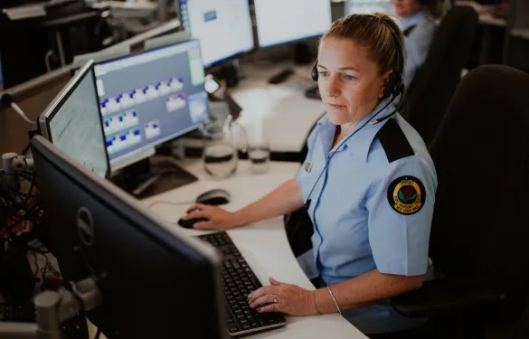 Female worker using a computer at the NSW SES Operations Centre.