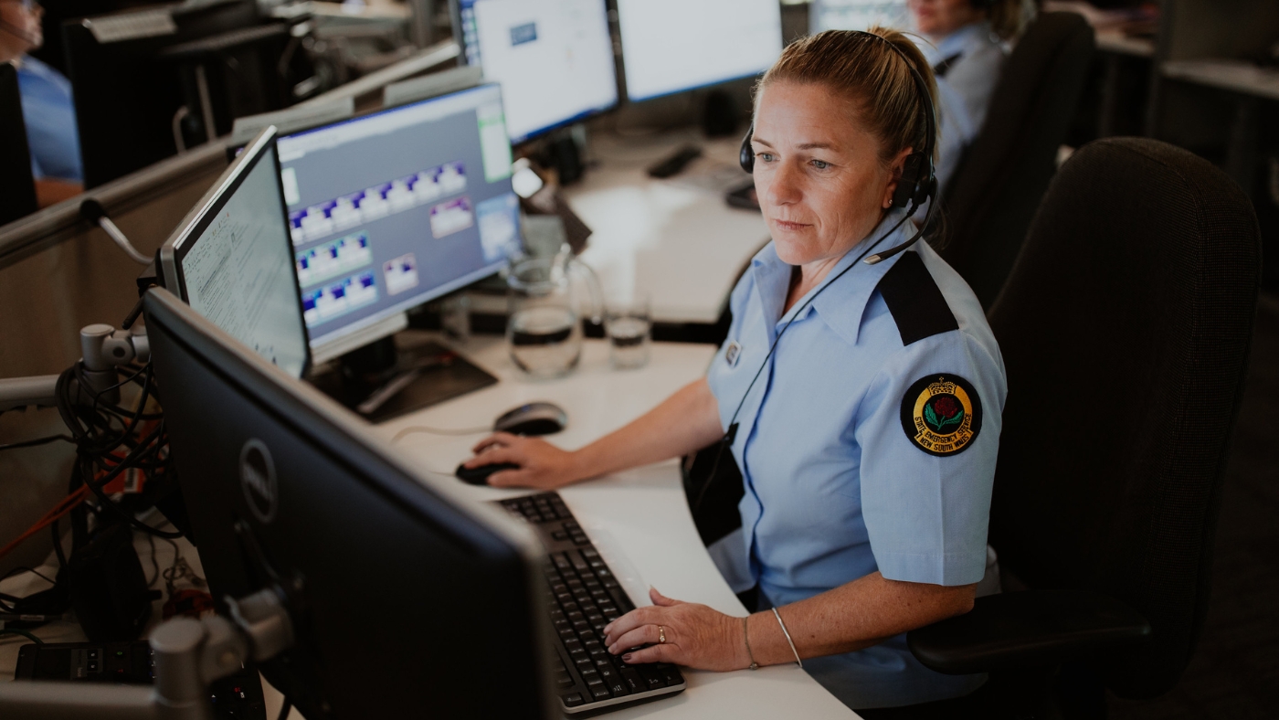 Female worker using a computer at the NSW SES Operations Centre.